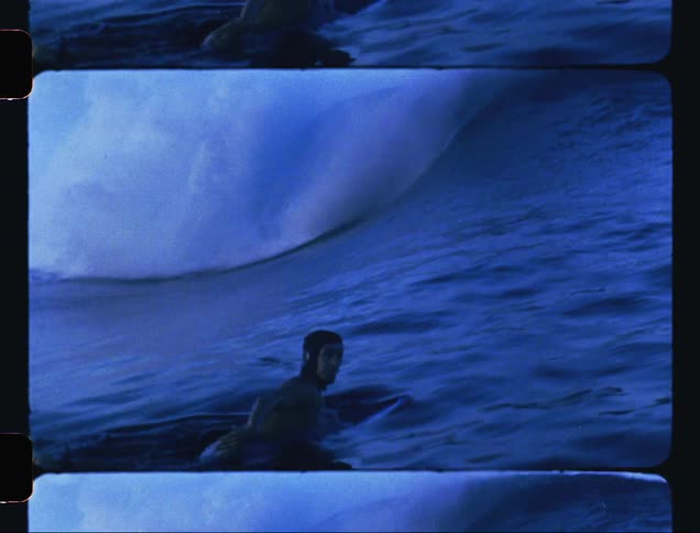 A man is surfing in the ocean