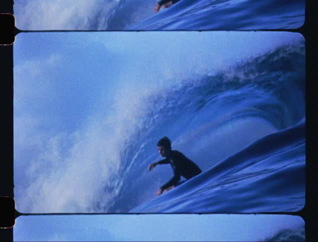 A man surfing a breaking wave
