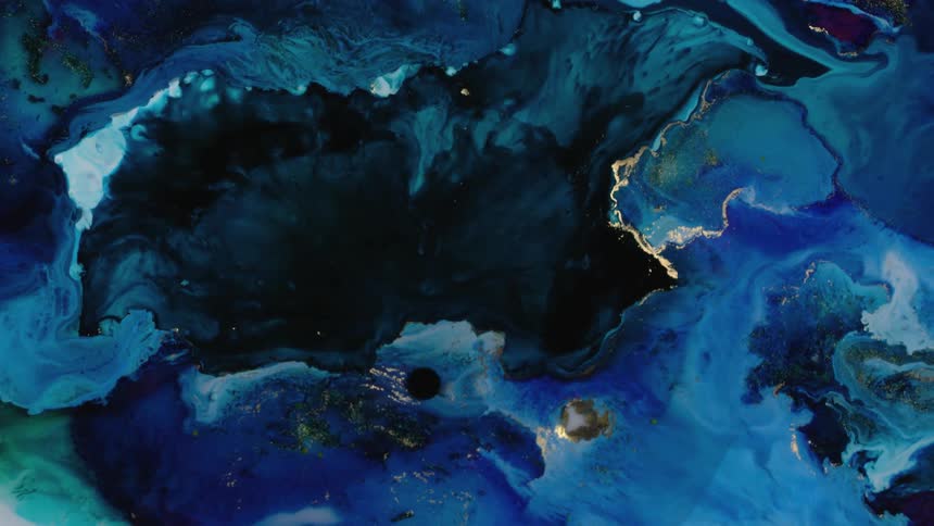 Liquid flowing inks creating an abstract background