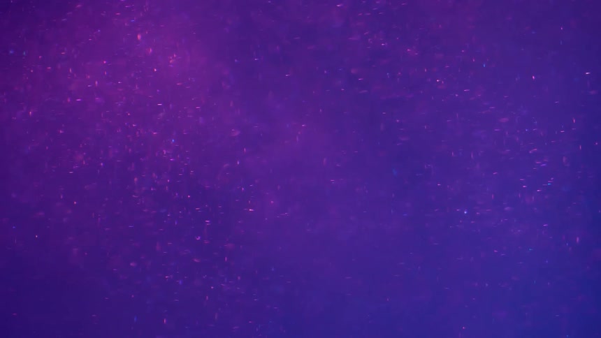 Floating sparkling metallic particles with neon lighting background