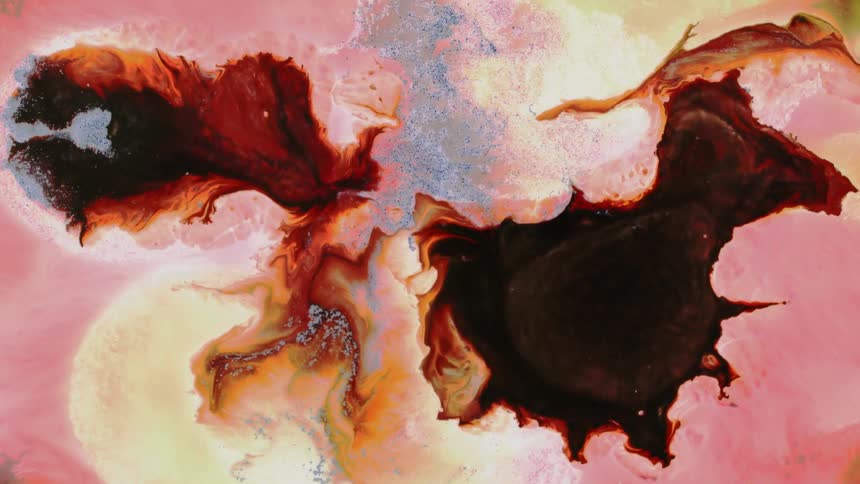 Liquid flowing inks creating an abstract background