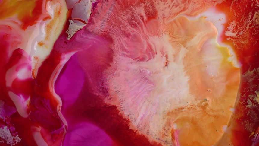 Liquid flowing inks creating an abstract background