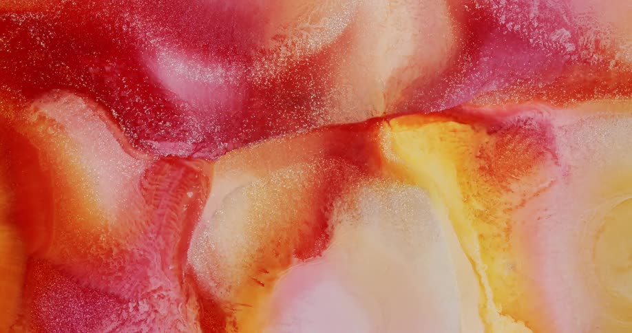 Waves of colorful liquids form abstract shapes
