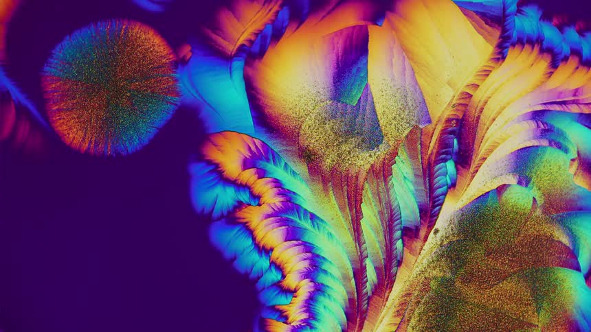 Abstract patterns of crystals from salicylic acid under microscope
