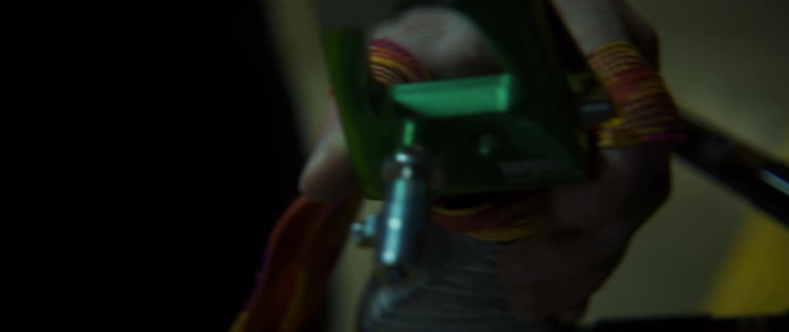 A person ties a rope on this tool