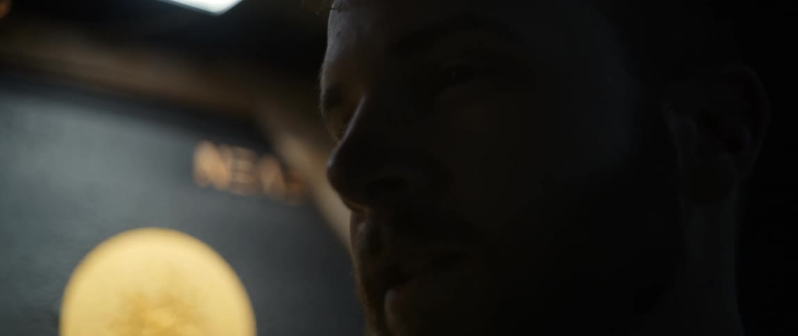 The mans face is covered in shadows