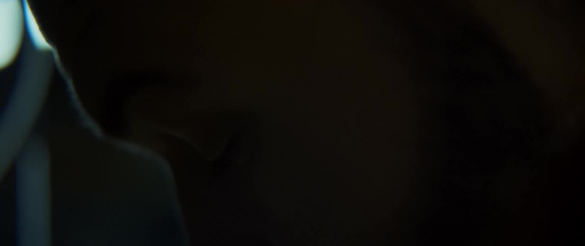 Silhouette of the face of a man at night