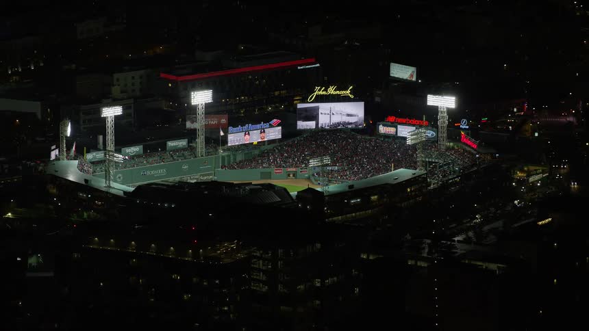 An aerial of a crowdfilled baseball stadium at night