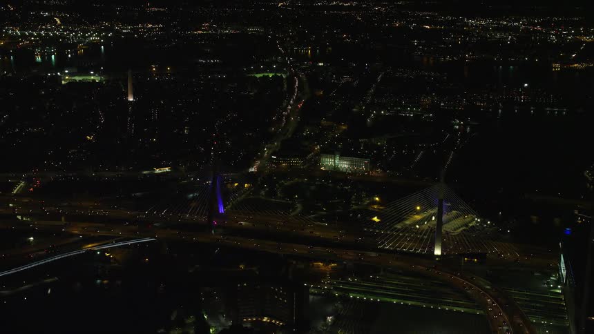 Aerial of moving cars in a metropolis at night