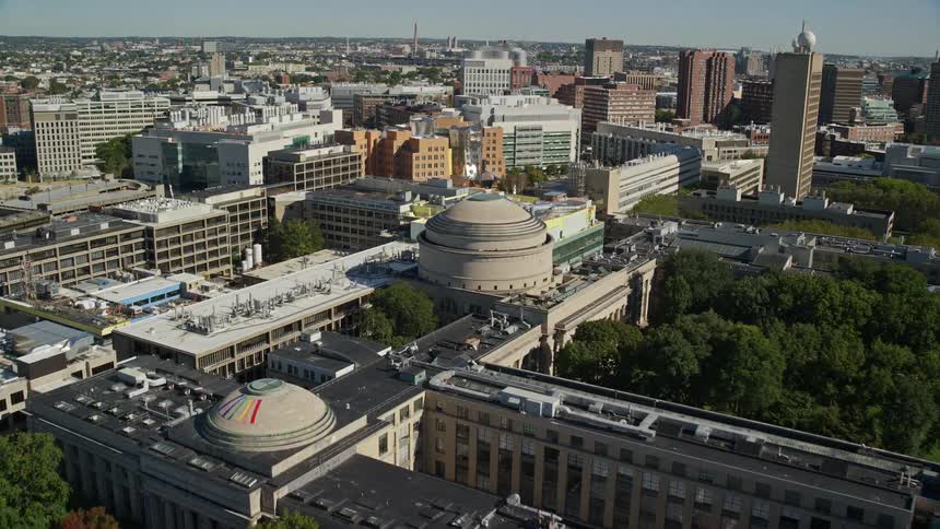 A metropolitan region with several buildings and a roundshaped building