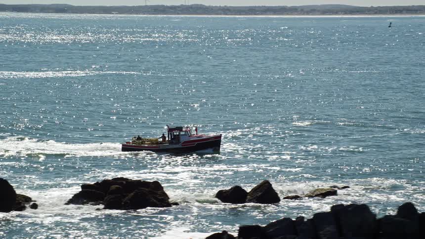 A small boat sailing in a sea