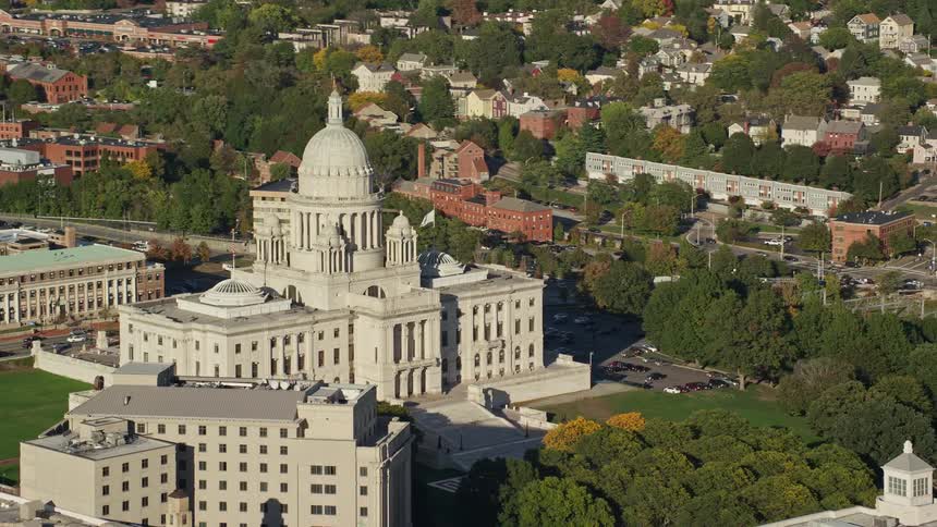 A large domed building is in the middle of the city