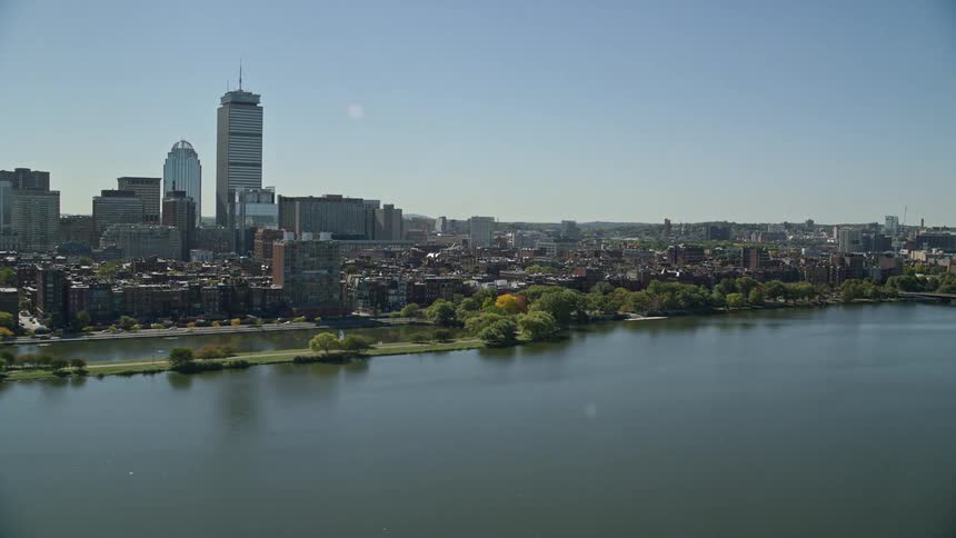 Aerial view of a city next to a river at daytime
