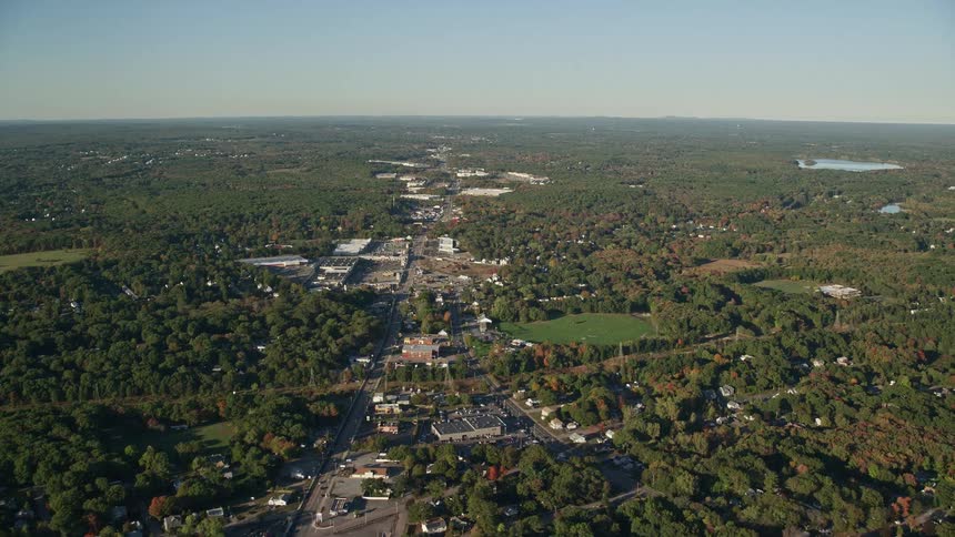 A rural region with a horizon full of forest trees