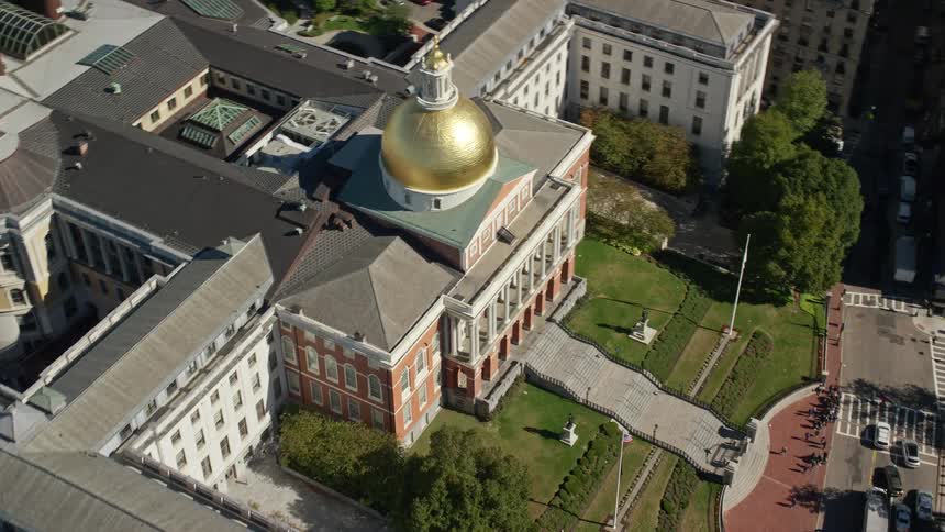 A large building with a golden and round structure on top