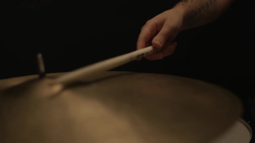A man is playing the drums