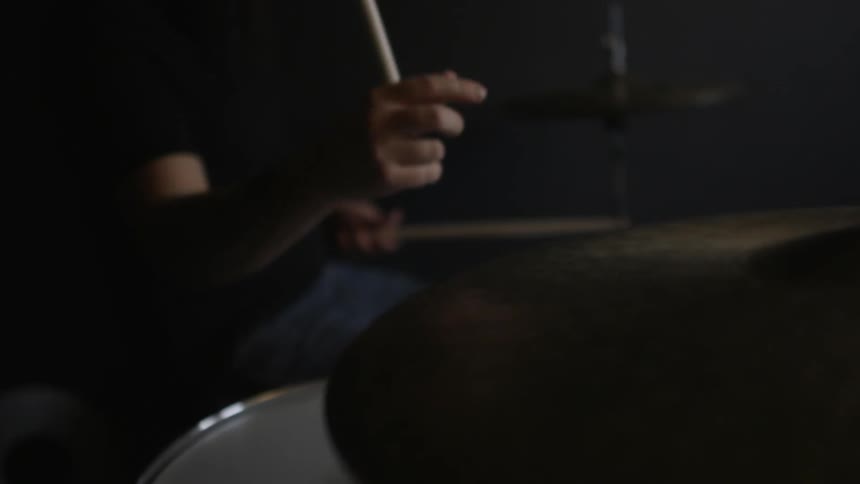A man is playing the drums