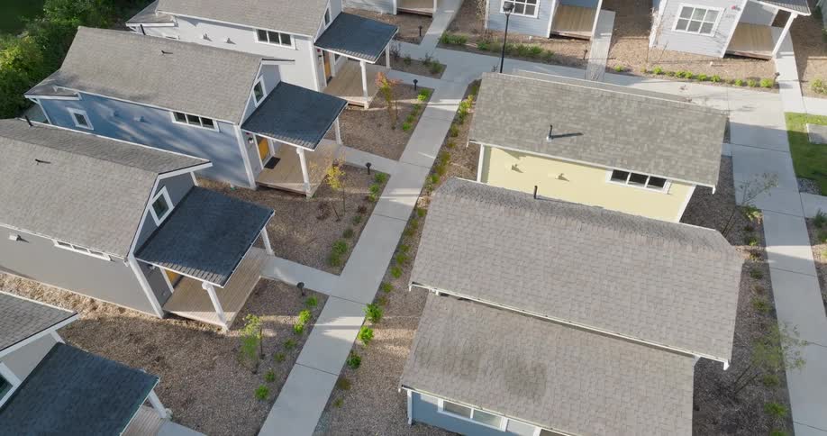 Low traverse over rows of tiny homes