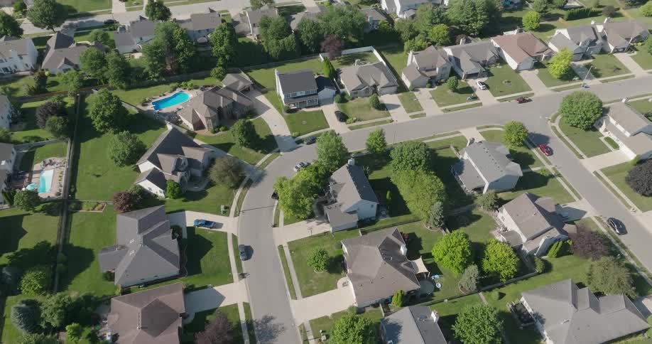 Low traverse over an upscale residential neighborhood