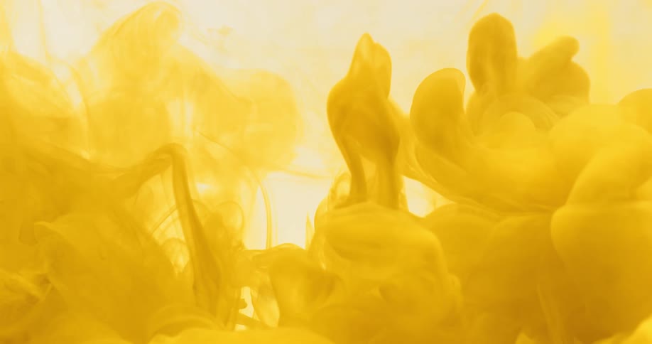 Abstract dense and yellow smoke being expelled