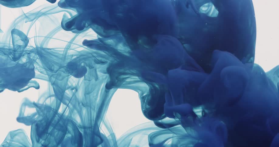 Blue dye spreads through water