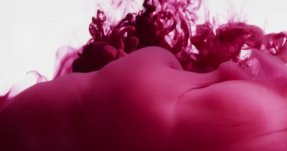 Abstract pink smoke fluid being poured