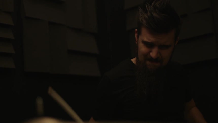 A man is playing drums