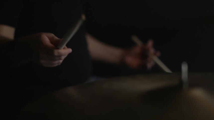 A man is playing the drums