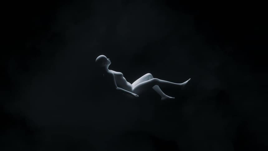 Light shines upon a statue of a woman falling from above in the darkness