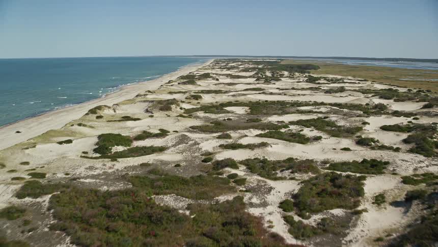 Fields and sandy scrub land occupy peninsula