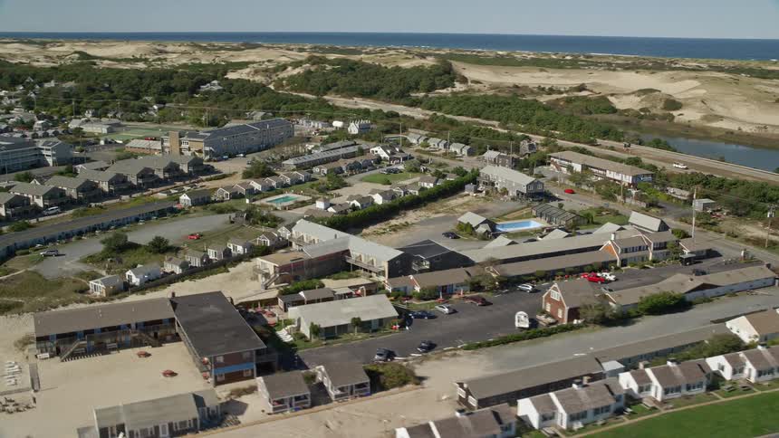 A group of homes are by the shore