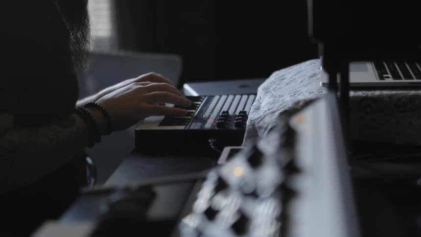 A man is using a keyboard
