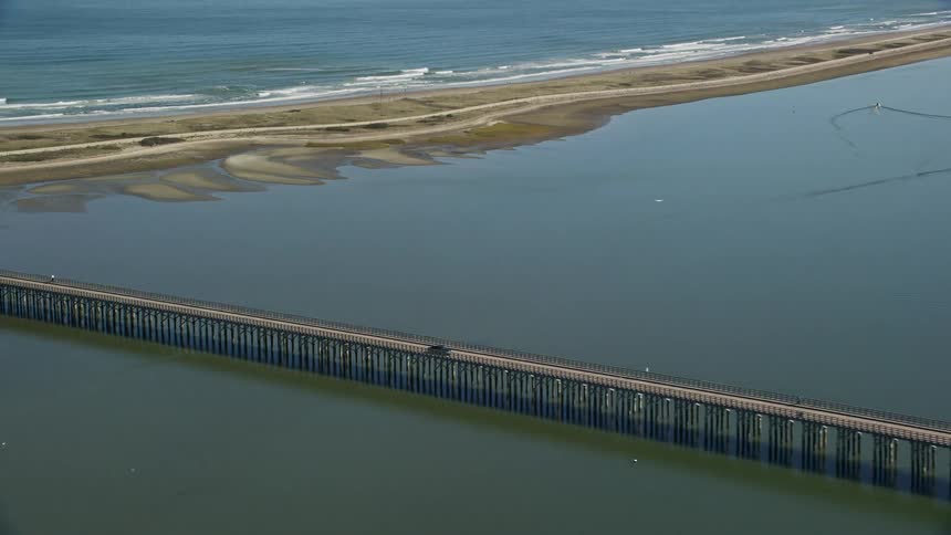 Vehicles cross the long bridge