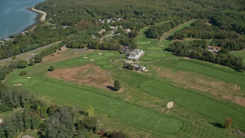 Aerial view of golf course near shoreline