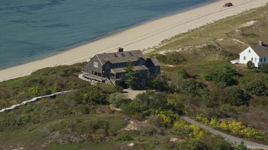 Multiple paths lead to house overlooking beach