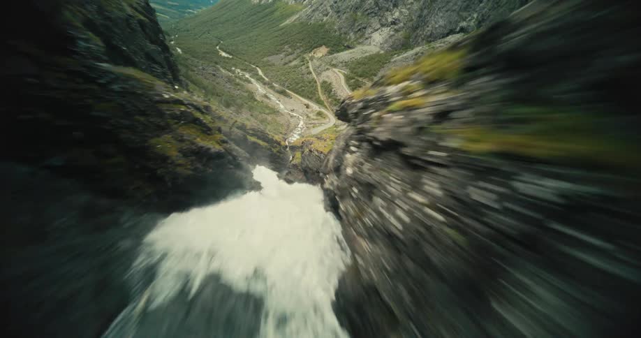 A stony mountain with a valley full of water running all the way down