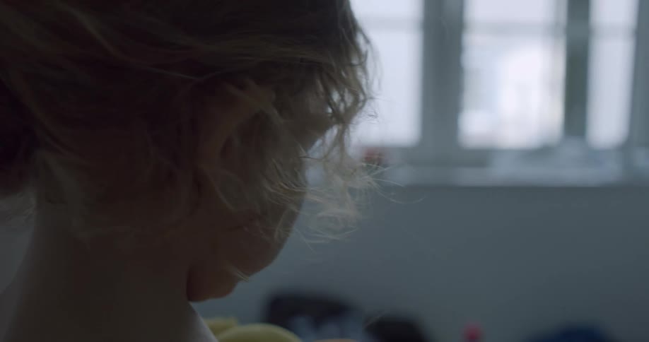 A child playing with a stuffed duck