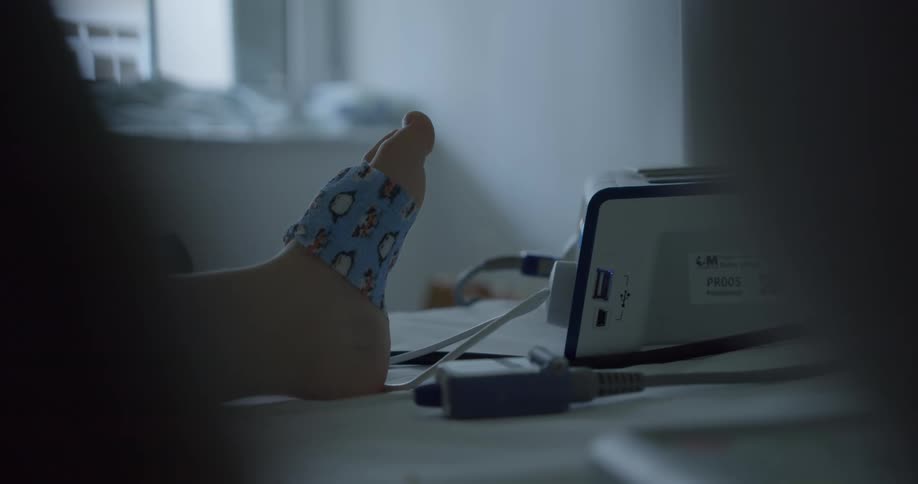 A human foot bandaged with a blue bandage