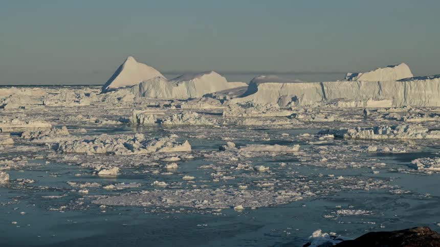 An arctic region with a sea full of ice