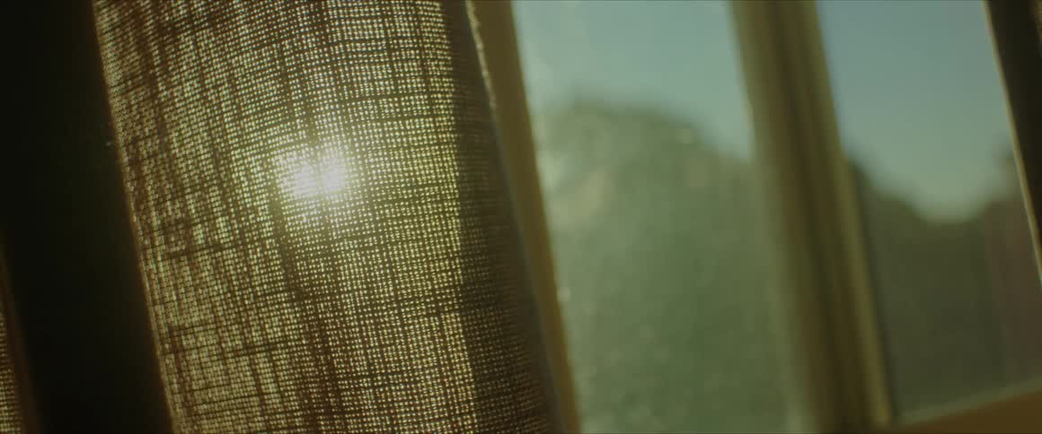 Morning sunlight filters through the curtains