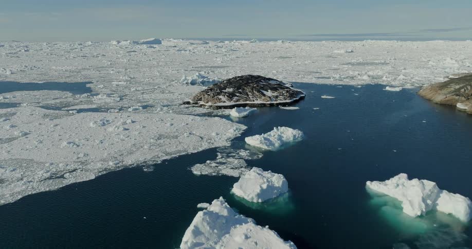 Aerial view of floating ice and isles in the ocean
