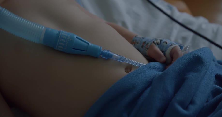 Belly of a toddler on a hospital bed