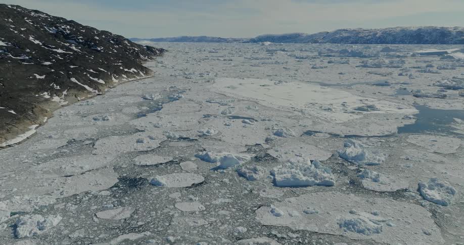 An aerial view of snow and ice covered mountains