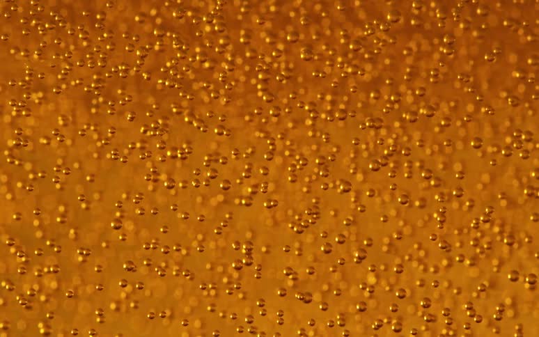 Abstract golden liquid with gas bubbles
