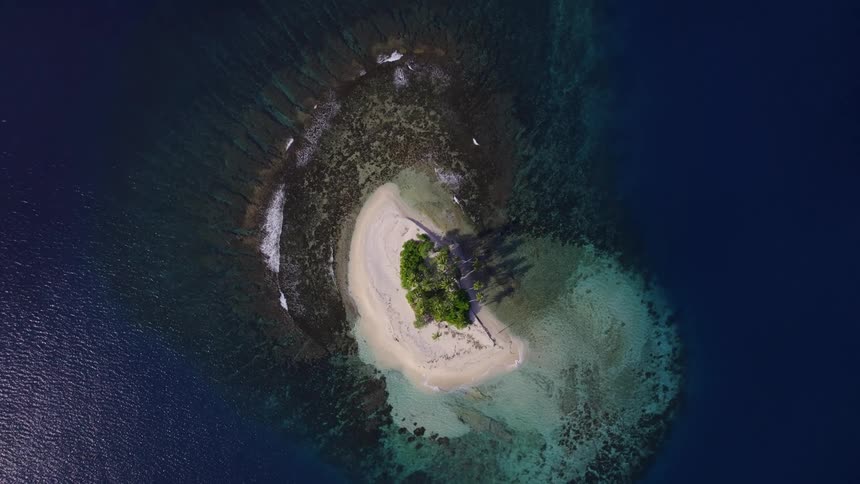 Aerial view of a small island surrounded by crystalclear waters