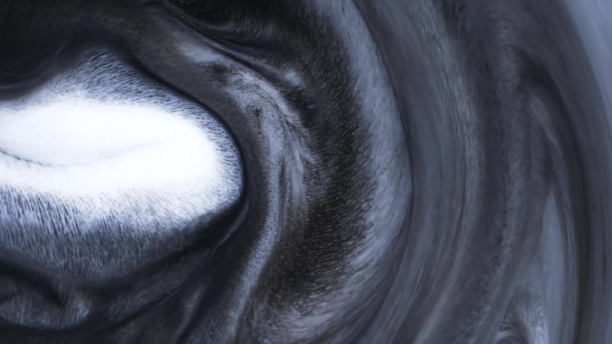 A smoky and gray texture rotating in a circular shape