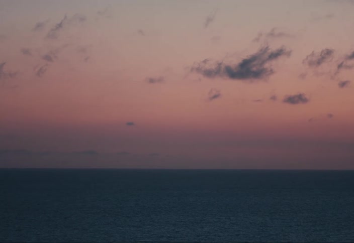 A view of the sea at sunset