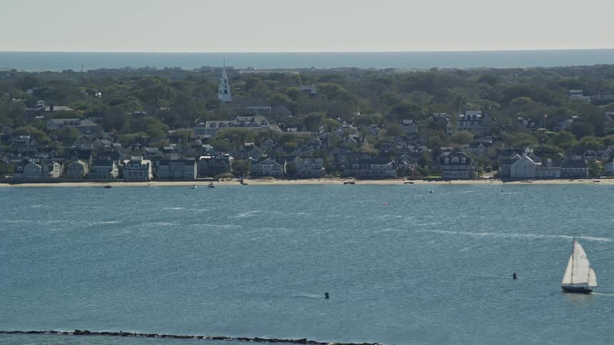 A suburban town close to shore as some beach houses are in sight