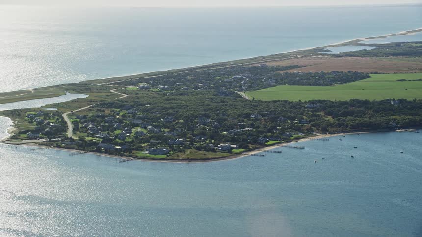 An island with a sub urban town surrounded by the sea