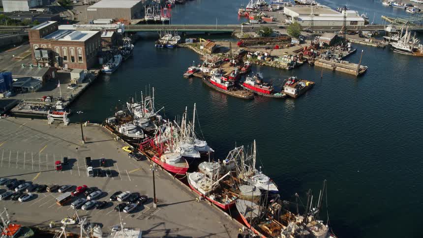 Aerial panorama of boats in docks by the city